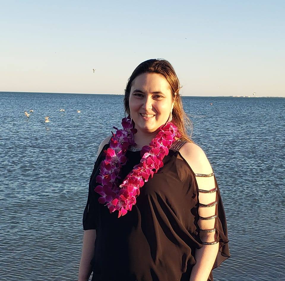 An image of the developer standing by the ocean